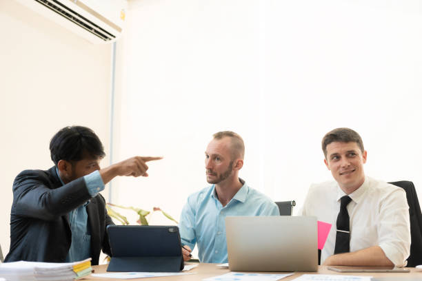 istock Diverse teams of top managers discuss, brainstorm, use digital tablets. Business partners discuss financial reports. Planning investment strategy in real estate 1475202162