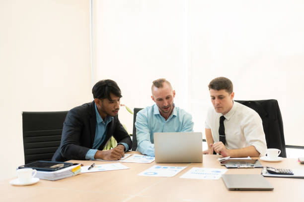 istock Diverse teams of top managers discuss, brainstorm, use digital tablets. Business partners discuss financial reports. Planning investment strategy in real estate 1475202170