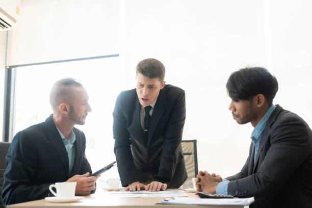 istock Diverse teams of top managers discuss, brainstorm, use digital tablets. Business partners discuss financial reports. Planning investment strategy in real estate 1475202185