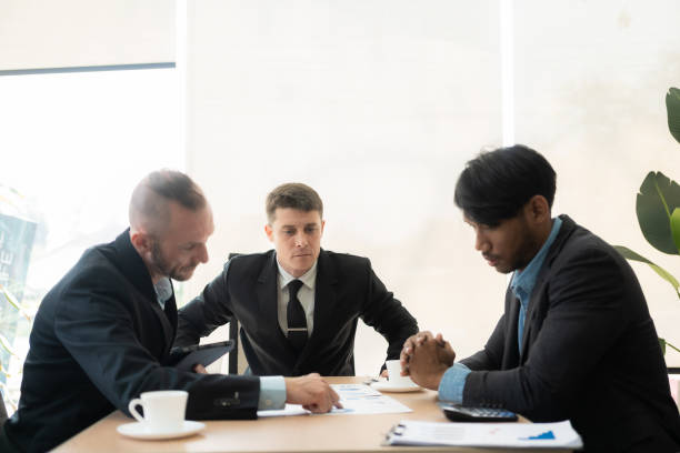 istock Diverse teams of top managers discuss, brainstorm, use digital tablets. Business partners discuss financial reports. Planning investment strategy in real estate 1475202189