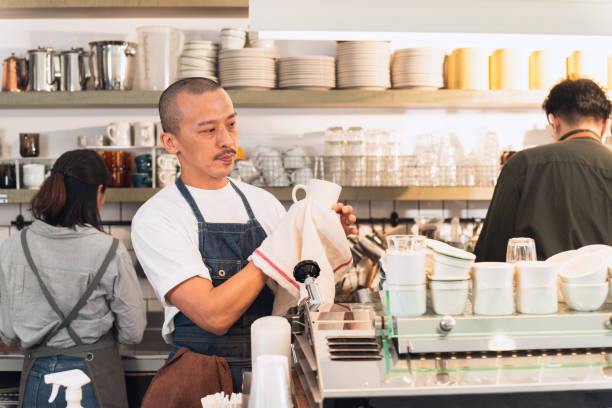 istock Barista tidy up before opening 1475205535