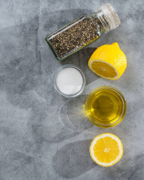 istock Salt, black pepper, olive oil, and lemon close-up, flat lay, copy space 1475205896