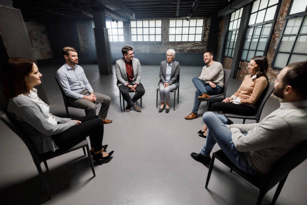 istock Group of people communicating during a group therapy. 1475205917