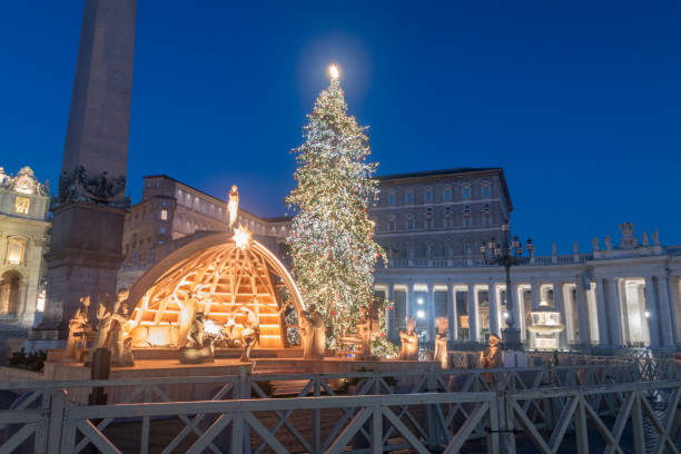 Nativity scene and Christmas tree in Vatican at night. stock photo