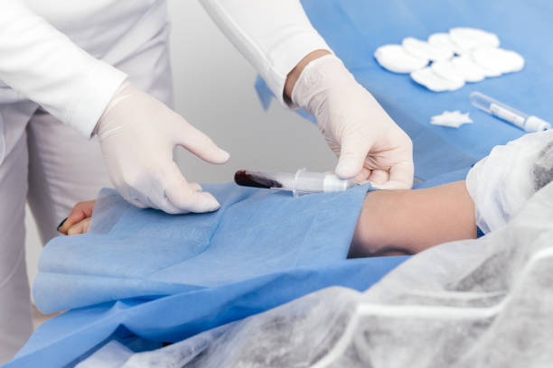 istock Laboratory worker doctor takes a blood sample for analysis, hand closeup. Blood sampling in the laboratory. Taking a blood in cosmetology clinic before PRP therapy procedure 1475211469