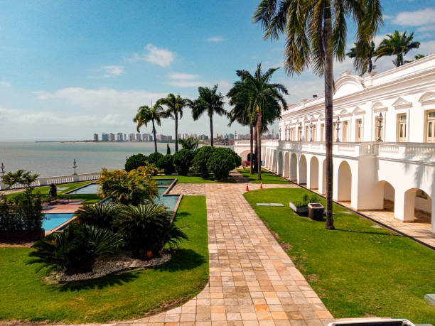 Garden of the Palácio dos Leões Garden of the Palácio dos Leões, with the Anil river, the Ponta D'areia neighborhood and the blue sky in the background sao luis stock pictures, royalty-free photos & images