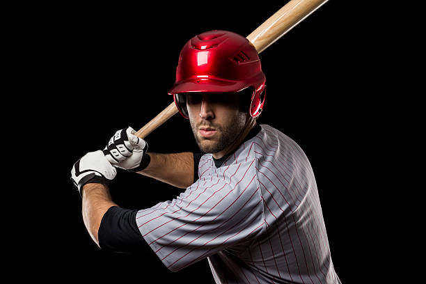istock A baseball player wearing a red helmet holding a bat 147521250