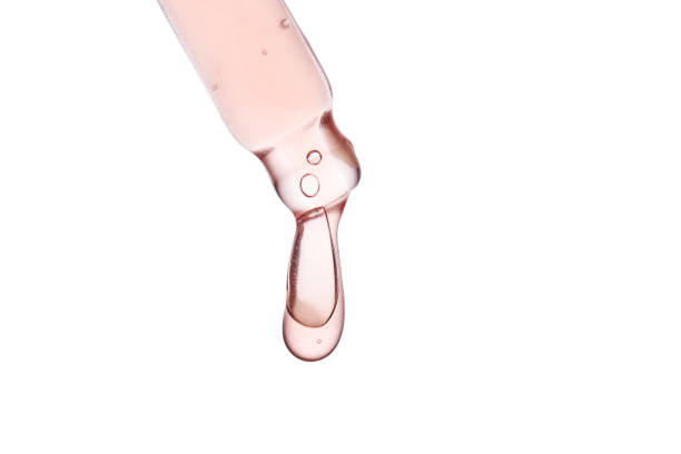 istock Pipette with a viscous pink cosmetic close-up. 1475213160