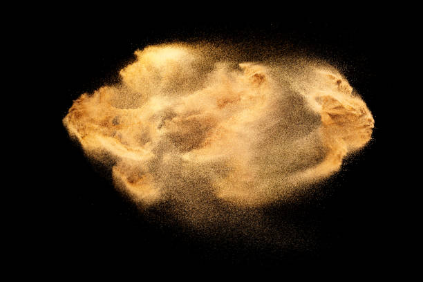 istock Brown colored sand splash.Dry river sand explosion isolated on black background. 1475213238