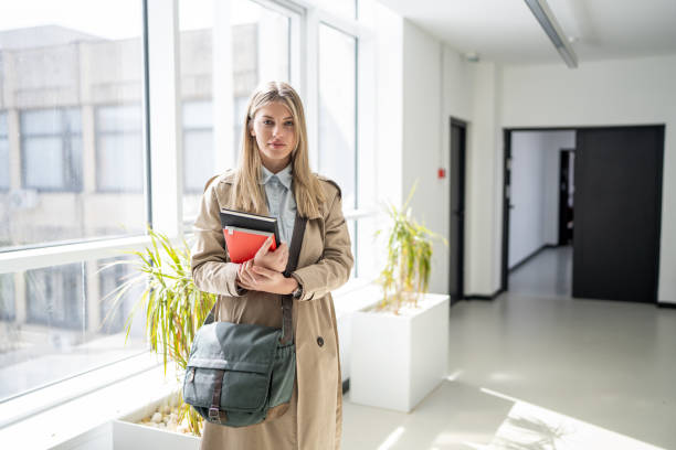 istock Portrait of beautiful young student at university building 1475213251