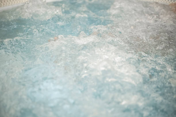 istock Bubbly and splashy hot tub at the spa 1475214877