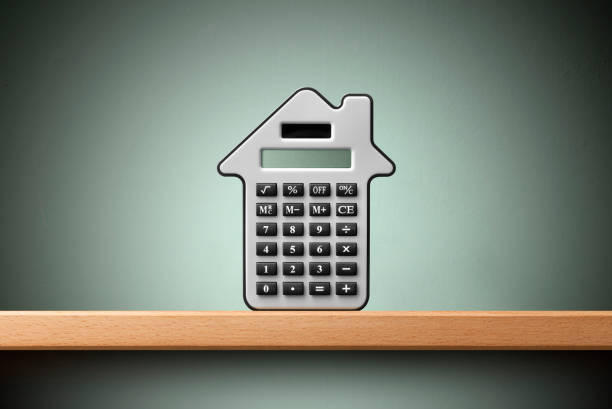 Calculator in form of house stock photo