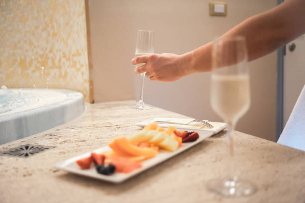 Cut up fruit with sparkling wine is what they serve at a VIP thermal spa