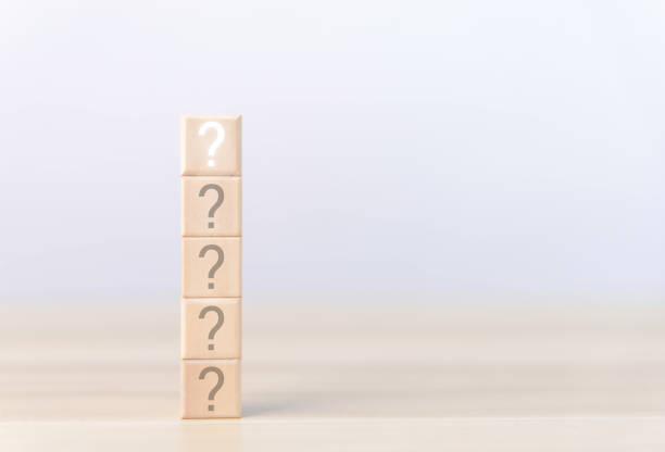 istock The stacked wooden cube blocks display a question mark. with copy space 1475216603