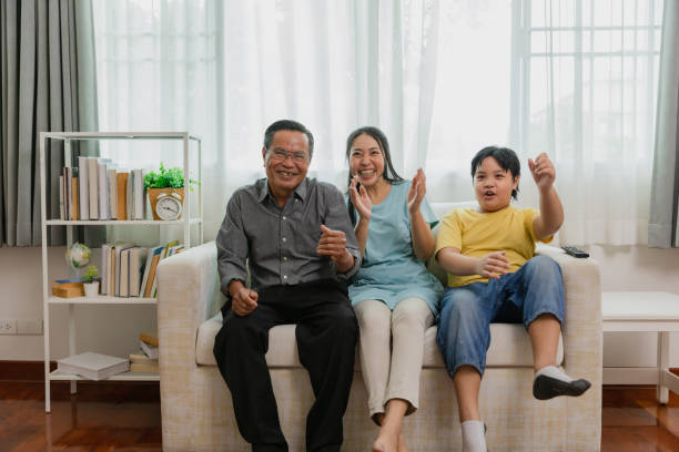 istock Multigenerational family watching TV together, fun. 1475218120