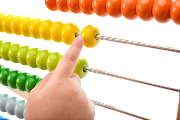 Little child playing with abacus close-up