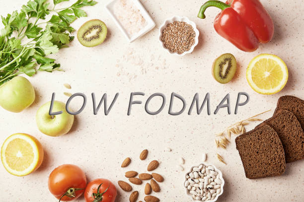 Low FODMAP concept with text in center. Low diet - fruits,vegetables, greenery, nuts, beans, flax seeds, chia seeds, wholegrain bread. Flat lay Low FODMAP concept with text in center. Low diet - fruits,vegetables, greenery, nuts, beans, flax seeds, chia seeds, wholegrain bread. Flat lay. oligosaccharide stock pictures, royalty-free photos & images