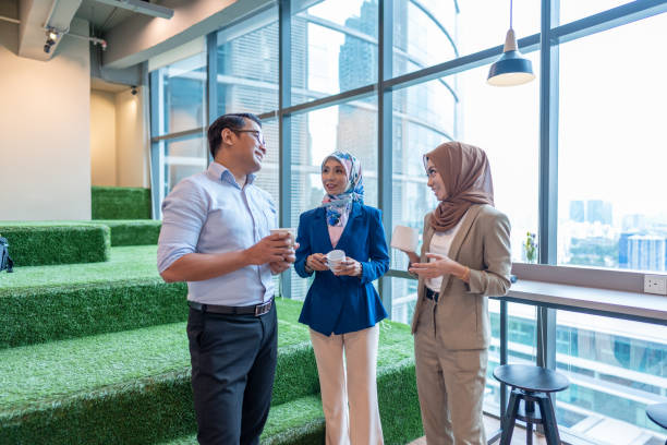 istock Happy business people taking a coffee break at work 1475219449