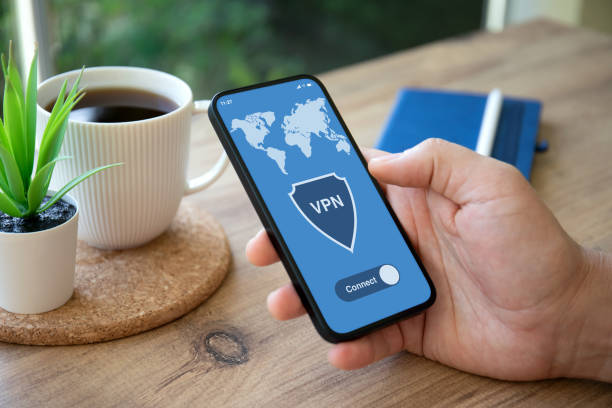 istock male hand holding phone with app vpn on screen 1475221284
