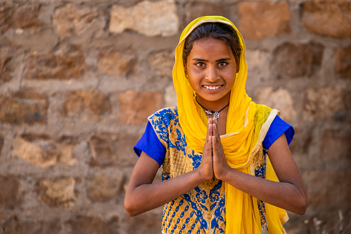 Namaste! - Portrait of happy Indian girl in desert village, India