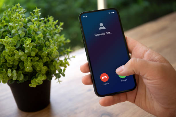 istock man hands holding phone with incoming call on screen 1475221650