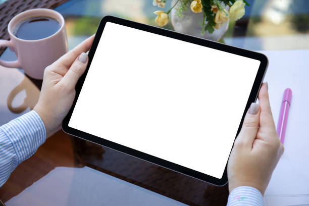 istock female hands hold computer tablet with isolated screen in cafe 1475222748