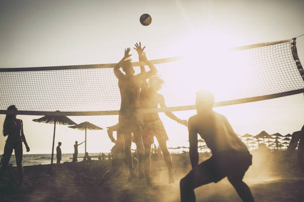 istock Playing beach volleyball at sunset! 1475223100