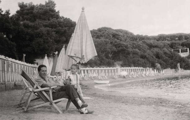 Father and daughter at the beach,1952.