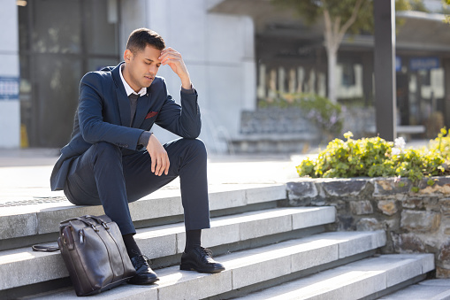 Stairs, mental health or sad business man fired from office building over career crisis, trading investment fail or unemployment. Depression mockup, trader mistake or lost job over stock market crash