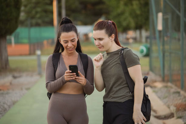 istock Personal trainer recommending her trainee how to stretch at home 1475225018