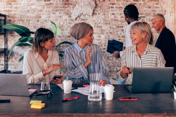 istock multiethnic female group working together at the desk office 1475226629