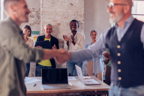 istock colleagues clapping hands in team brainstorming - success, agreement concept 1475226755