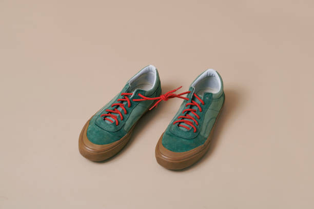 istock sneakers with its shoelaces tied together 1475226956