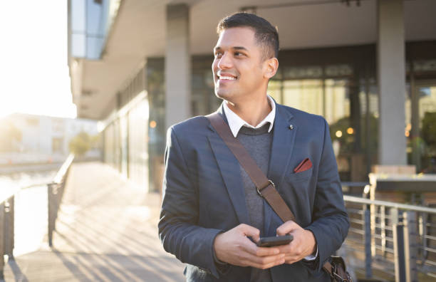 istock Search, happy or business man with phone for internet research, communication or networking. Tech, online or manager in street on 5g smartphone for social network, blog review or media app content 1475226995