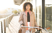 Bicycle travel, portrait or black woman cycling to work, career job or relax morning journey in San Francisco city. Eco friendly transportation, street road and happy business employee with bike