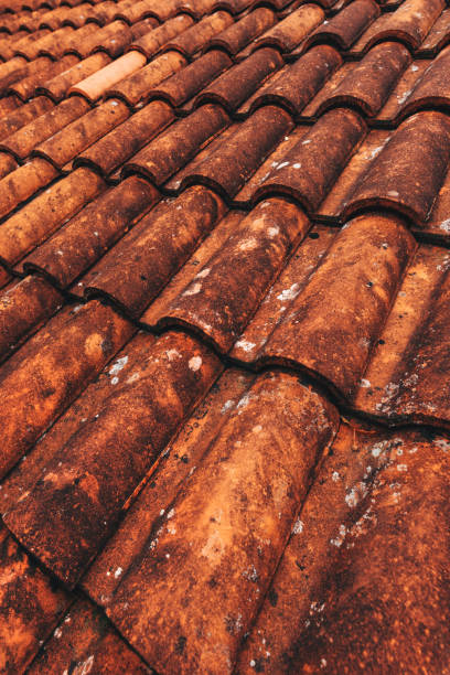 istock Old rustic terracotta roof tiles pattern as background 1475227992