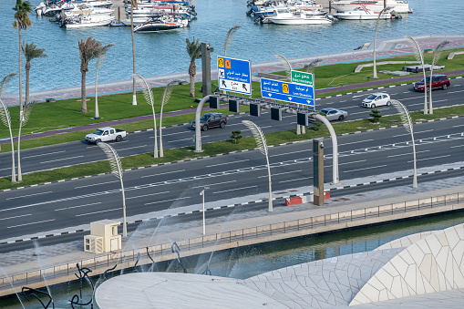 Doha, Qatar - March 19, 2023: Aerial view of Doha Roads and traffic on corniche road
