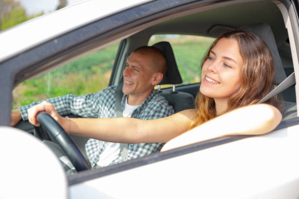 istock Woman and man talking in car during common trip 1475228578