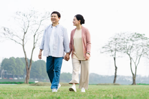 istock Elderly Asian couple in the park 1475229506