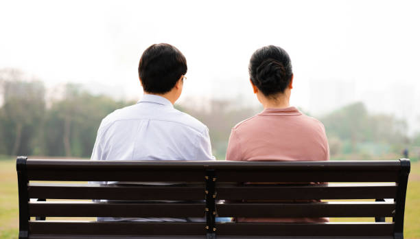 istock Elderly Asian couple in the park 1475229541