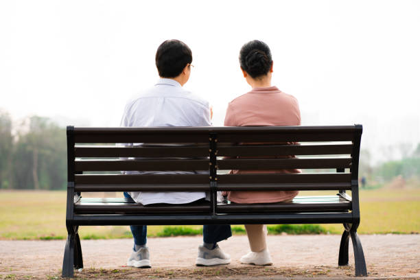 istock Elderly Asian couple in the park 1475229544