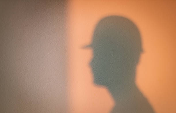istock Shadow of young worker at construction site 1475230560
