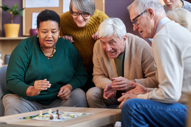 istock Senior people playing board games together 1475231296