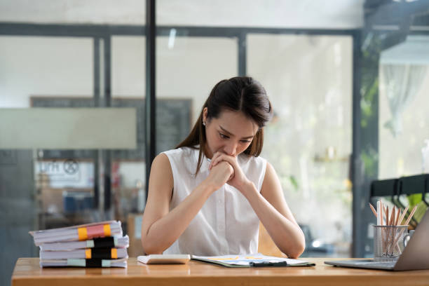 istock Headache, business woman working on computer stress while working for a deadline 1475233249