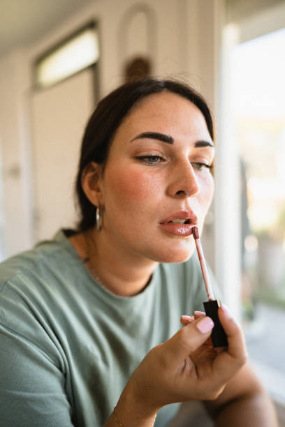 istock woman using make up in the bathroom 1475233450