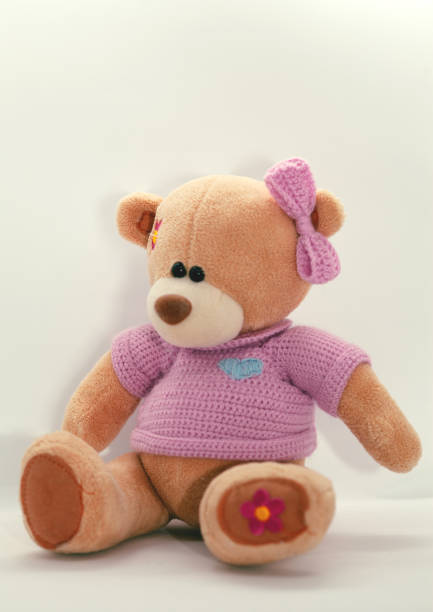 istock a toy bear in a blue dress 1475234713