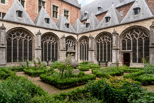 Middelburg, Netherlands - July 27, 2022: Cloister garden of the historic abbey in Middelburg. Provinz of Zeeland in the Netherlands