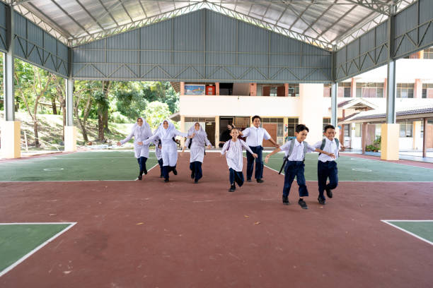 istock Students racing across outdoor recreation area 1475235932