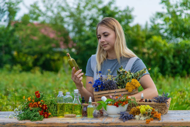 istock Woman with medicinal herbs and tinctures. Selective focus. 1475237336