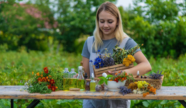 istock Woman with medicinal herbs and tinctures. Selective focus. 1475237348